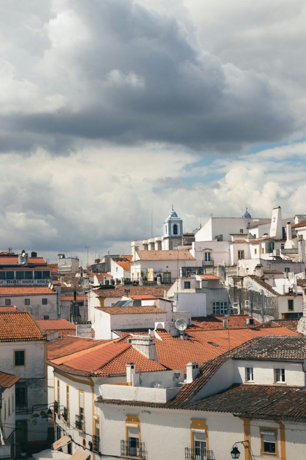 Panoramic view of Óbidos medieval walled town with white-washed houses and castle